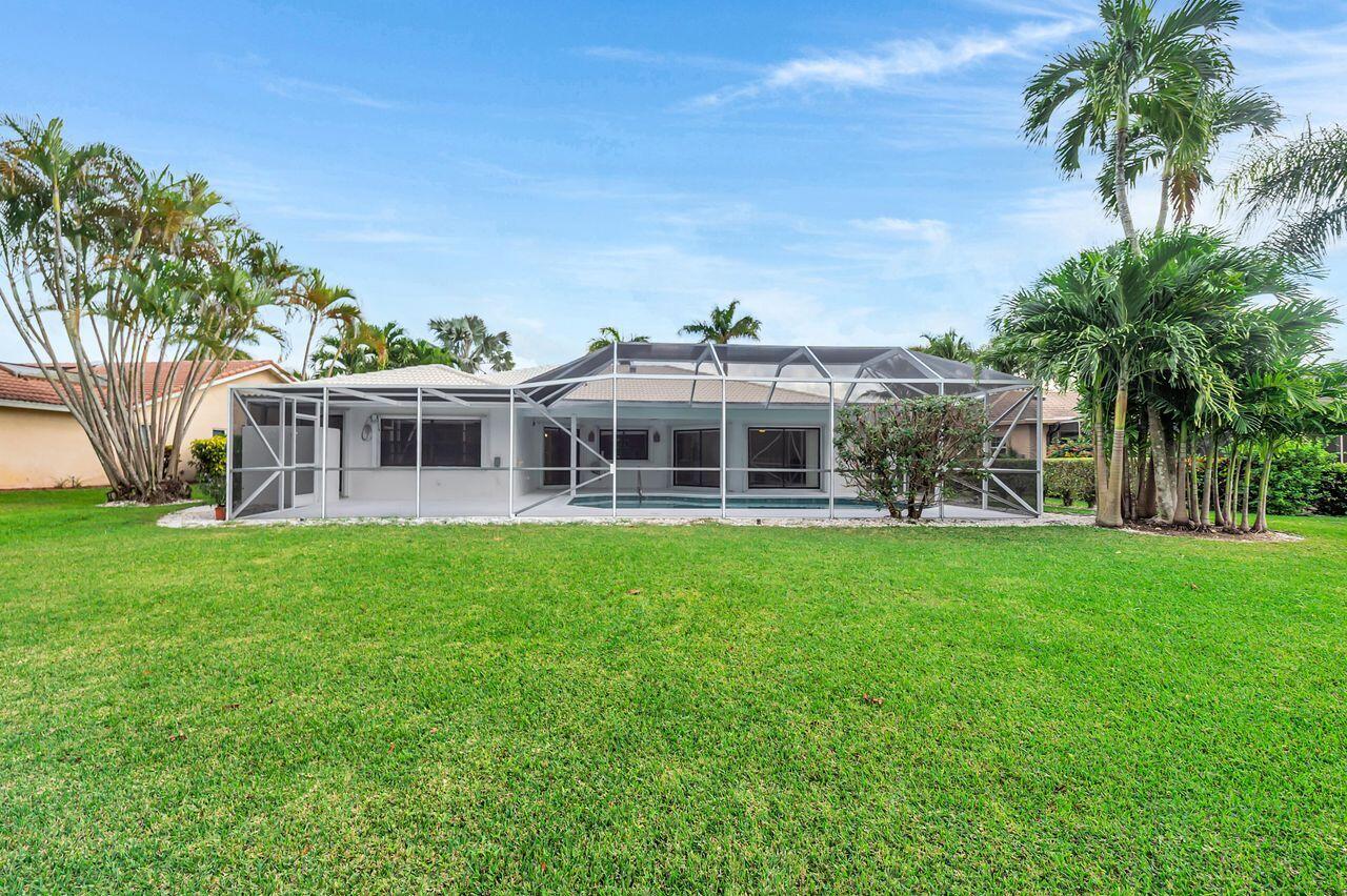 19699 Boca Greens Drive Boca Raton, FL 33498 - Photo 5 of 43 a view of a house with a backyard