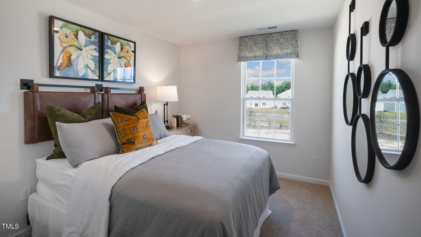 5233 Red Crimson Drive Willow Spring, NC 27592 - Photo 21 of 35 a bed sitting in a bedroom next to a window