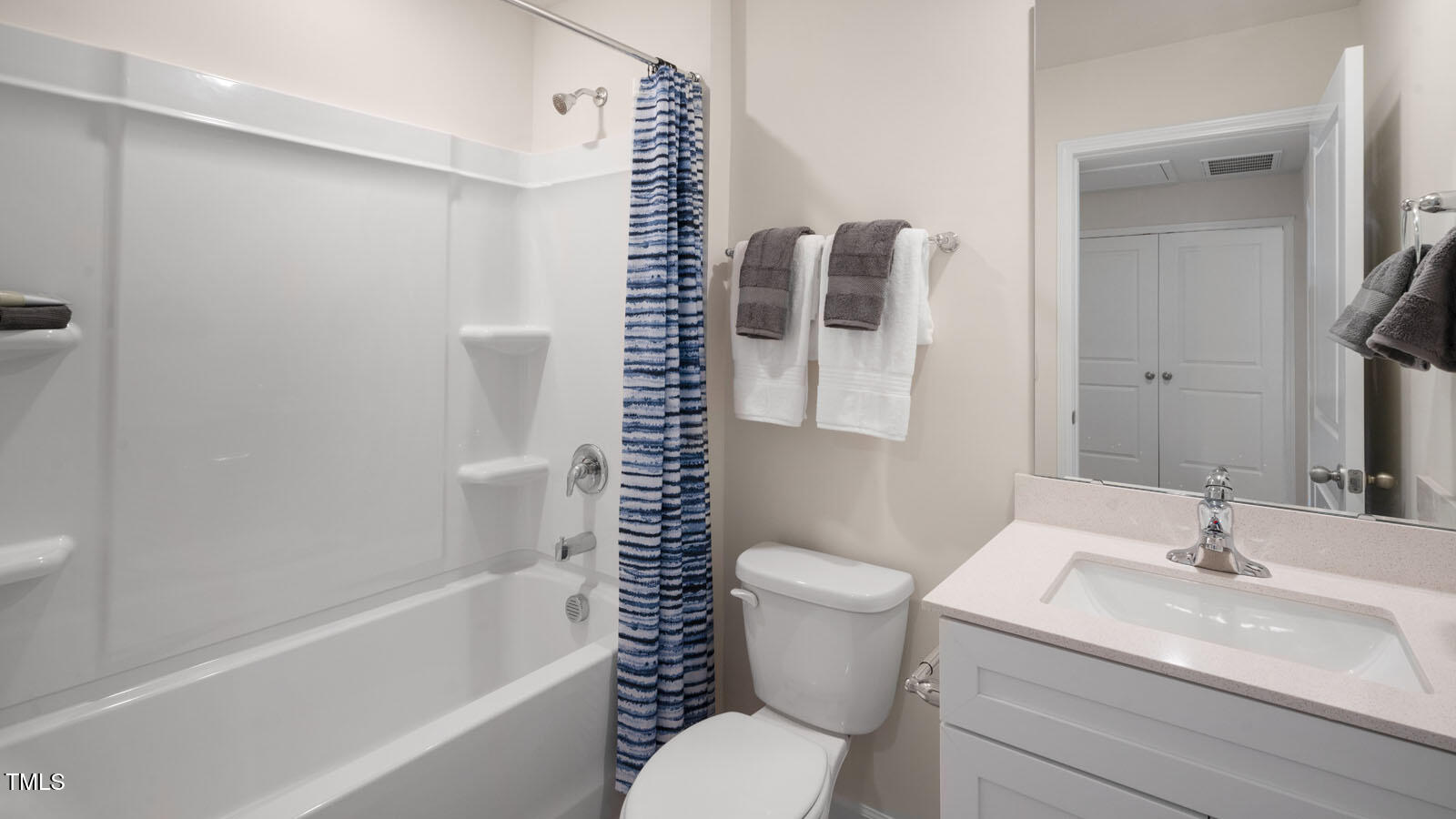 5233 Red Crimson Drive Willow Spring, NC 27592 - Photo 28 of 35 a bathroom with a sink toilet and shower