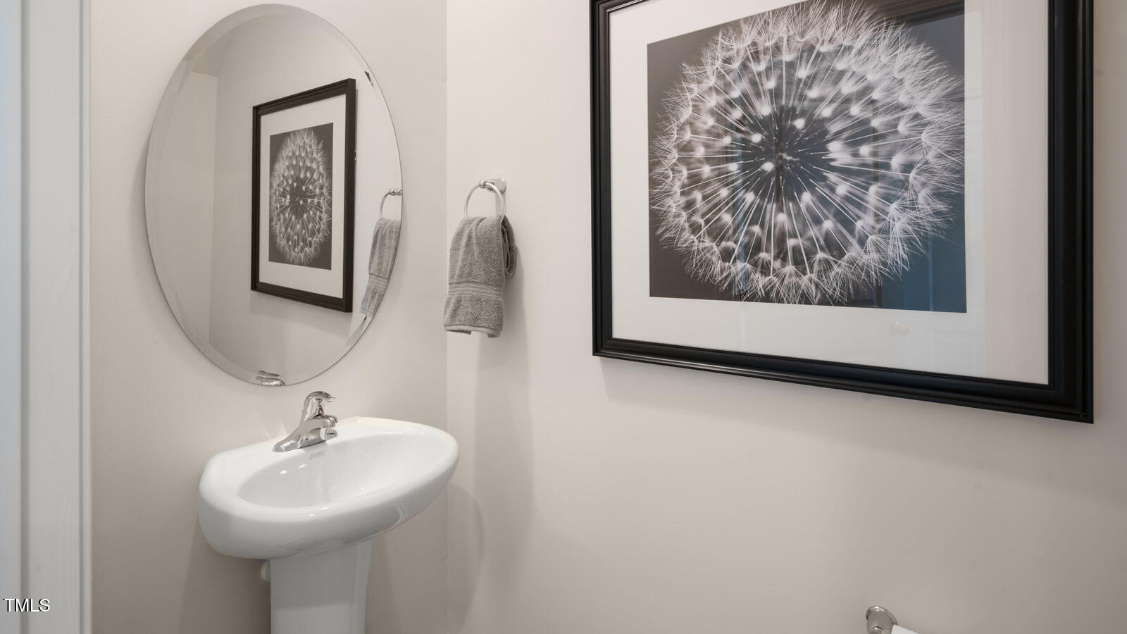 5233 Red Crimson Drive Willow Spring, NC 27592 - Photo 30 of 35 a bathroom with a sink and a mirror