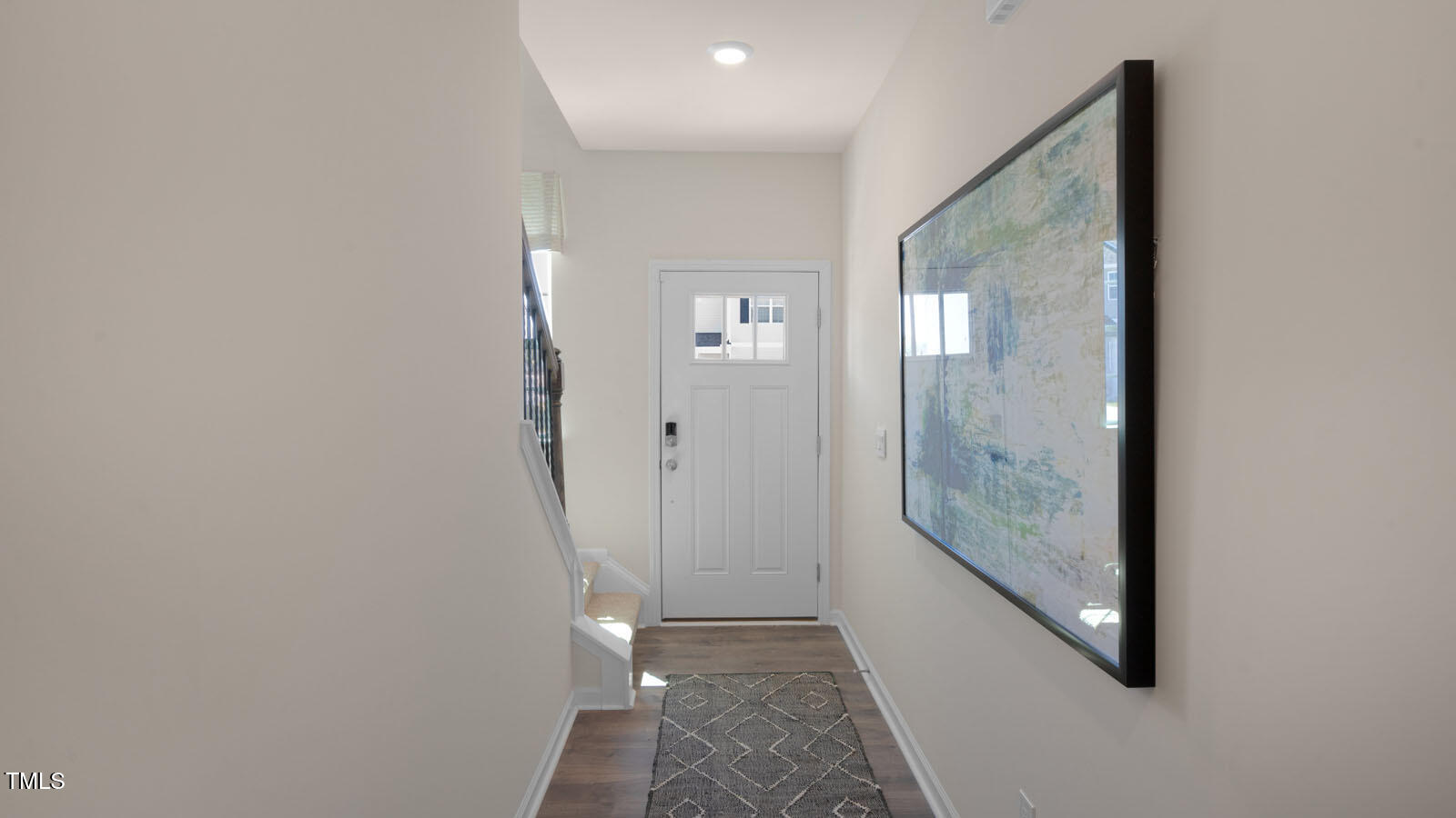 5233 Red Crimson Drive Willow Spring, NC 27592 - Photo 3 of 35 a view of a hallway with wooden floor and a hallway
