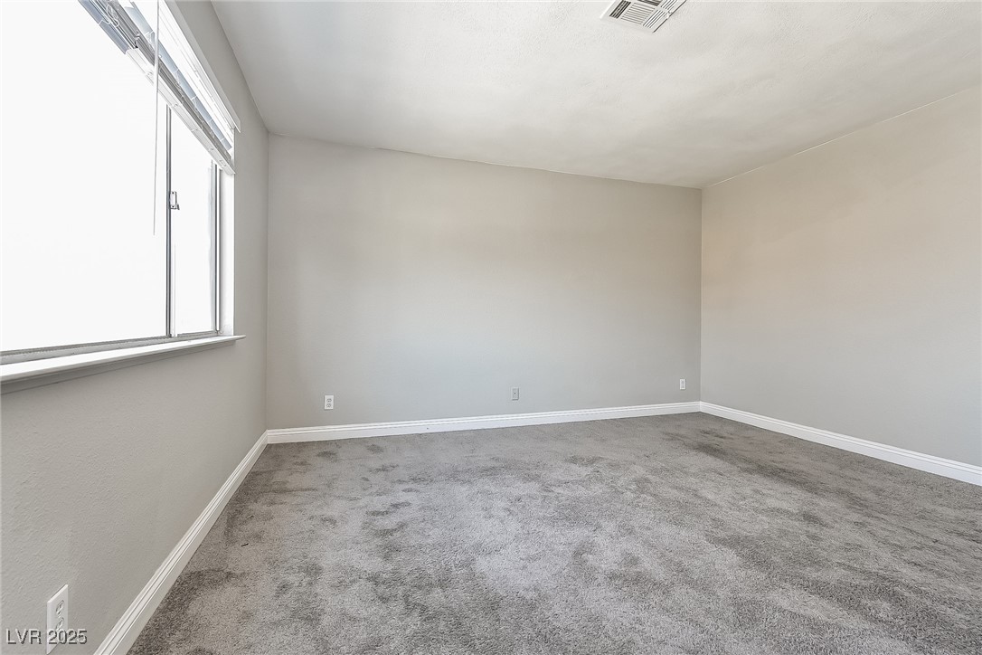 741 Round Table Drive Las Vegas, NV 89110 - Photo 13 of 22 Carpeted spare room featuring baseboards