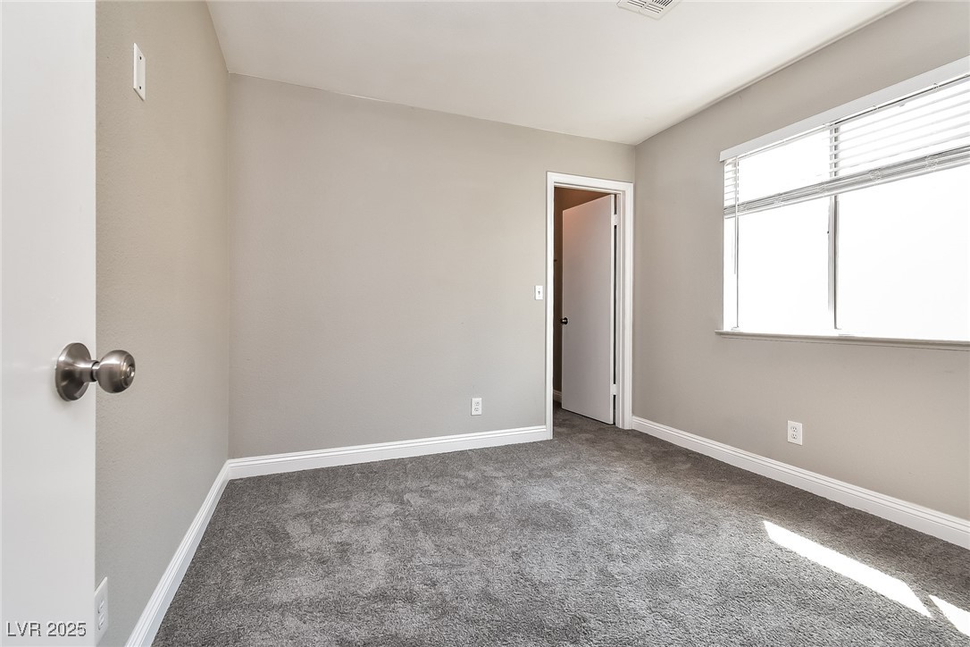 741 Round Table Drive Las Vegas, NV 89110 - Photo 14 of 22 Carpeted spare room featuring baseboards