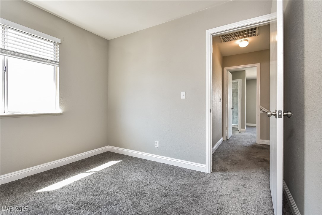 741 Round Table Drive Las Vegas, NV 89110 - Photo 15 of 22 Spare room featuring carpet and baseboards