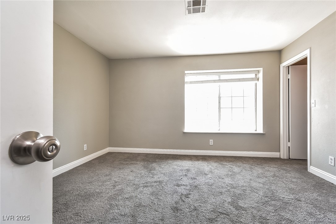 741 Round Table Drive Las Vegas, NV 89110 - Photo 16 of 22 Carpeted empty room featuring baseboards