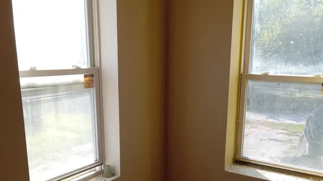 a bathroom with a glass shower door