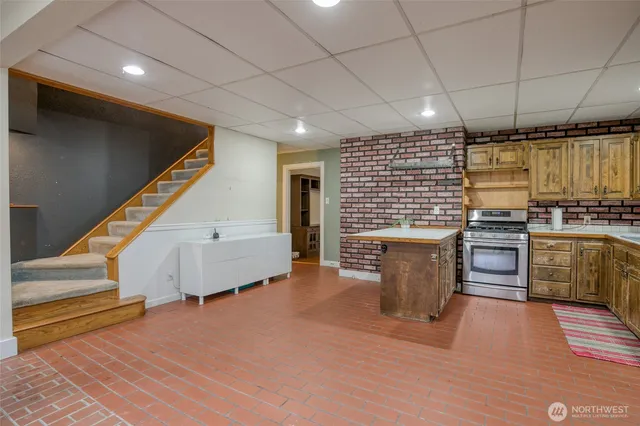 a kitchen with stove and cabinets