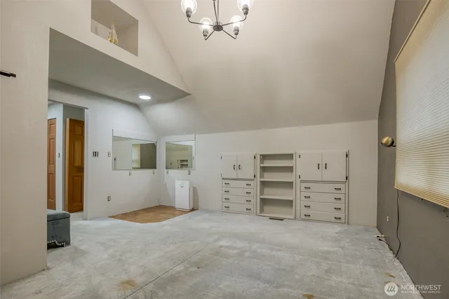 a view of room with cabinet and stairs