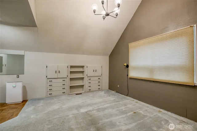 a view of a bedroom with cabinet cabinet and windows