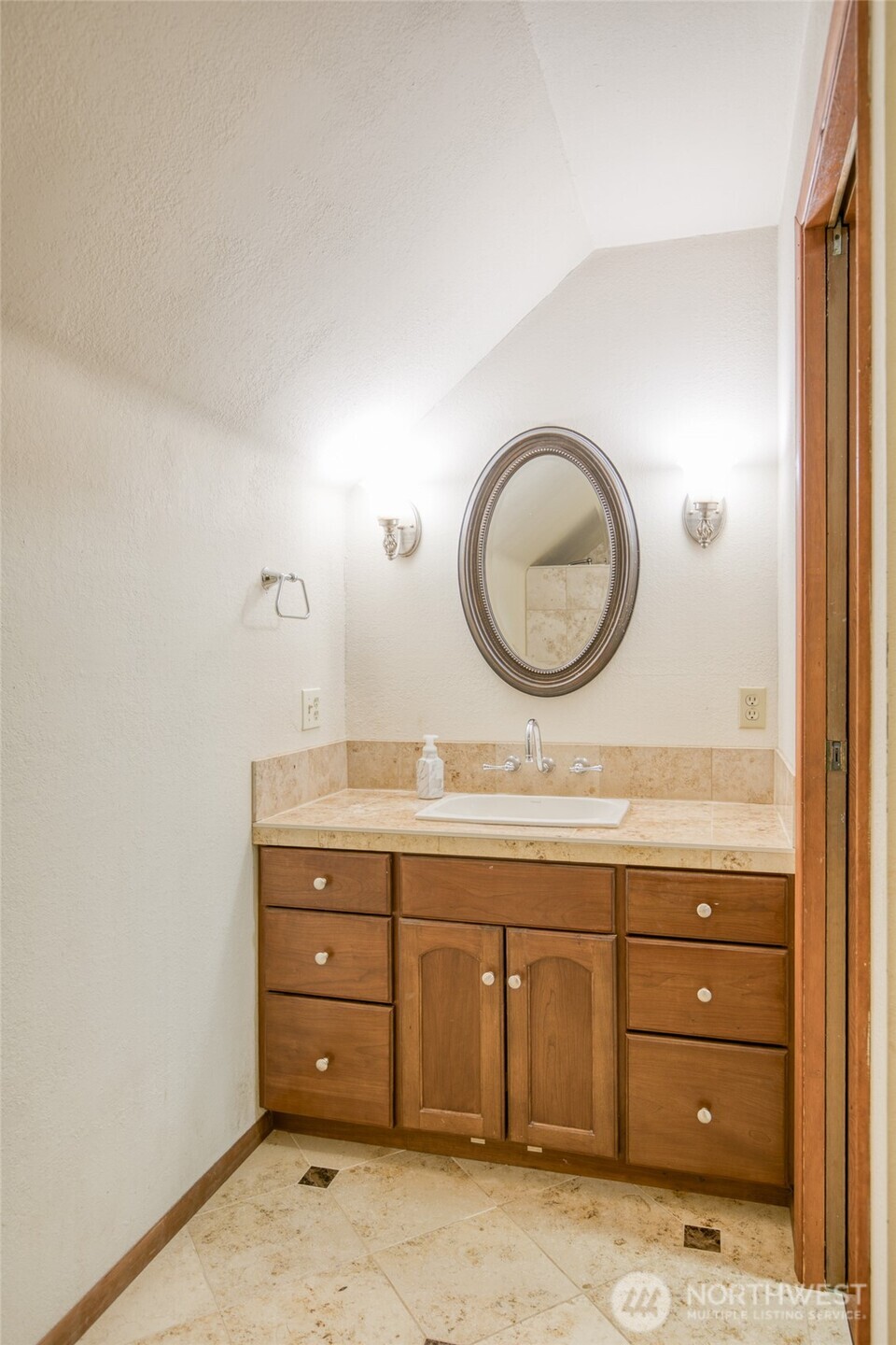 3321 Wishkah Road Aberdeen, WA 98520 - Photo 17 of 40 a view of a bathroom sink and a mirror