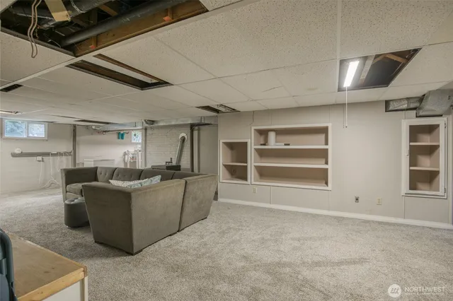 a living room with furniture and windows