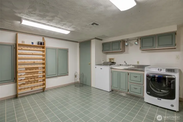 a utility room with cabinets