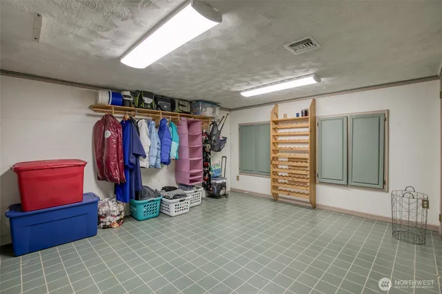 a front view of a house with a yard table and chairs