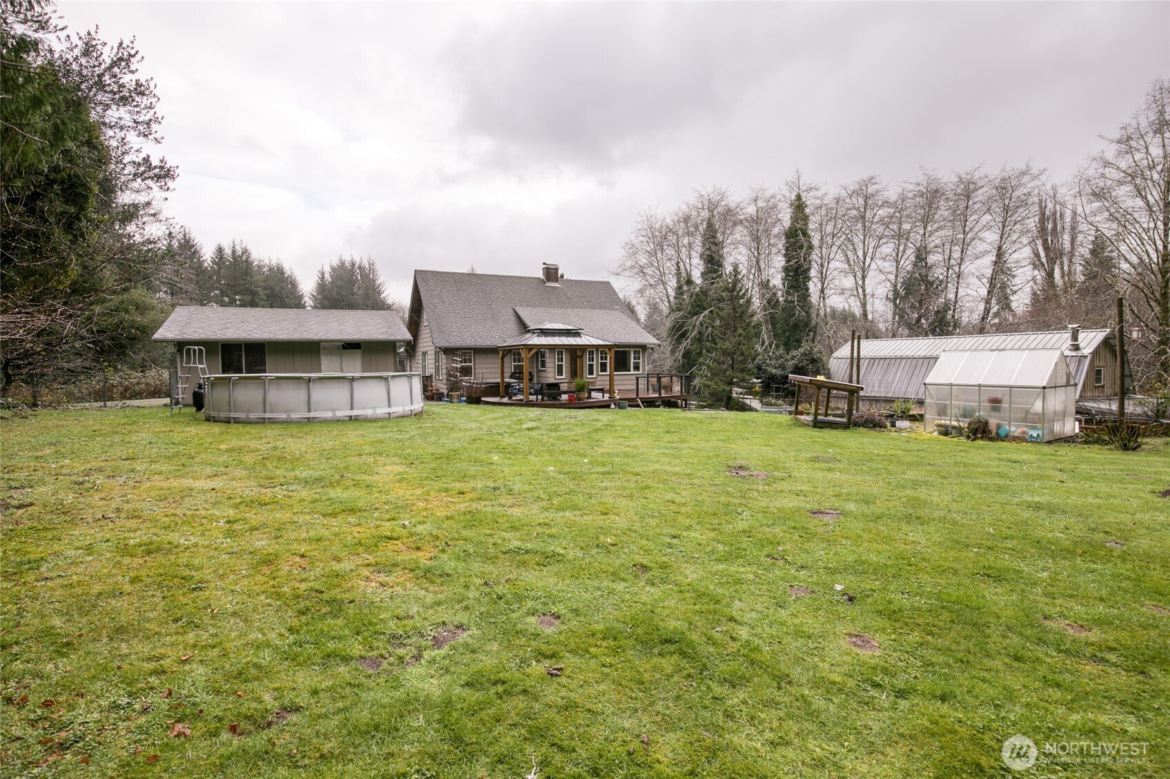3321 Wishkah Road Aberdeen, WA 98520 - Photo 31 of 40 a view of a house with a big yard and large trees