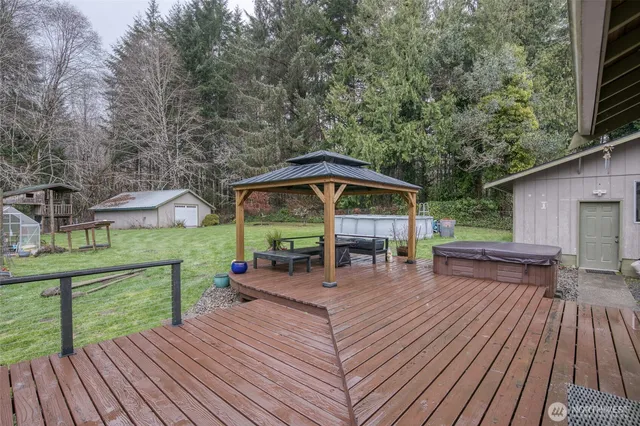 a view of a patio with table and chairs potted plants with wooden floor