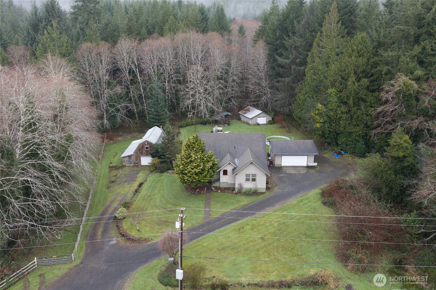 3321 Wishkah Road Aberdeen, WA 98520 - Photo 37 of 40 a view of a wooden house with a yard