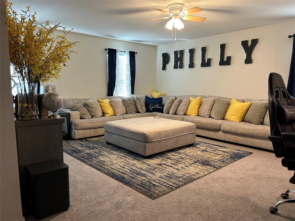 10109 Wyseby Road Crowley, TX 76036 - Photo 12 of 25 a living room with furniture and a lamp