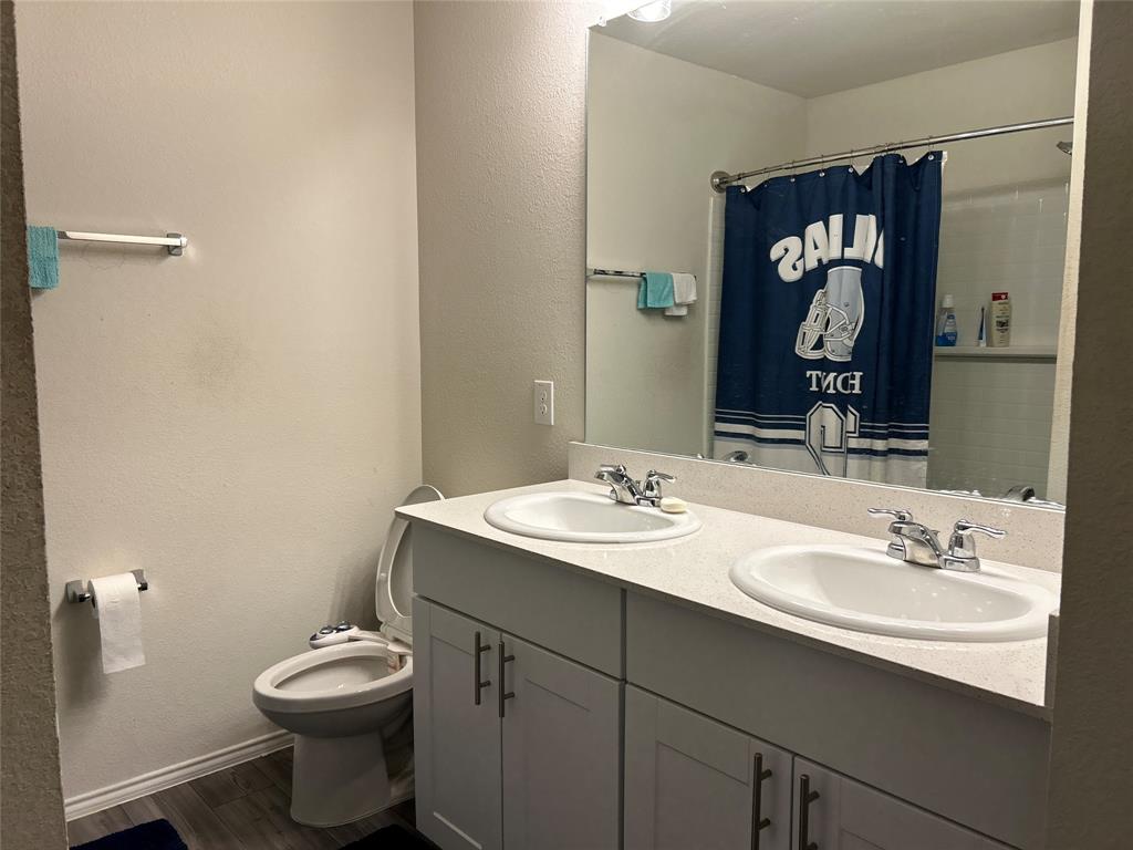 10109 Wyseby Road Crowley, TX 76036 - Photo 20 of 25 a bathroom with a sink toilet and shower