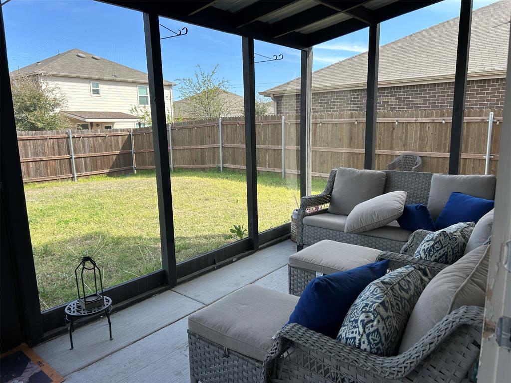10109 Wyseby Road Crowley, TX 76036 - Photo 21 of 25 a living room with furniture and a floor to ceiling window