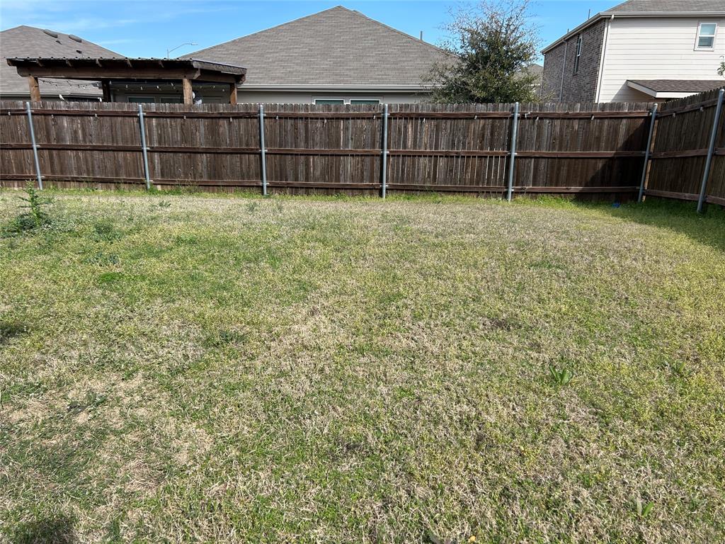 10109 Wyseby Road Crowley, TX 76036 - Photo 23 of 25 a view of backyard with wooden fence