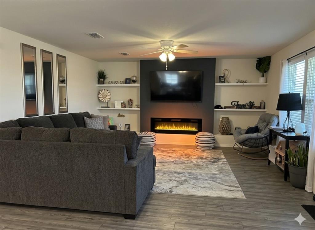 10109 Wyseby Road Crowley, TX 76036 - Photo 4 of 25 a living room with furniture and a flat screen tv