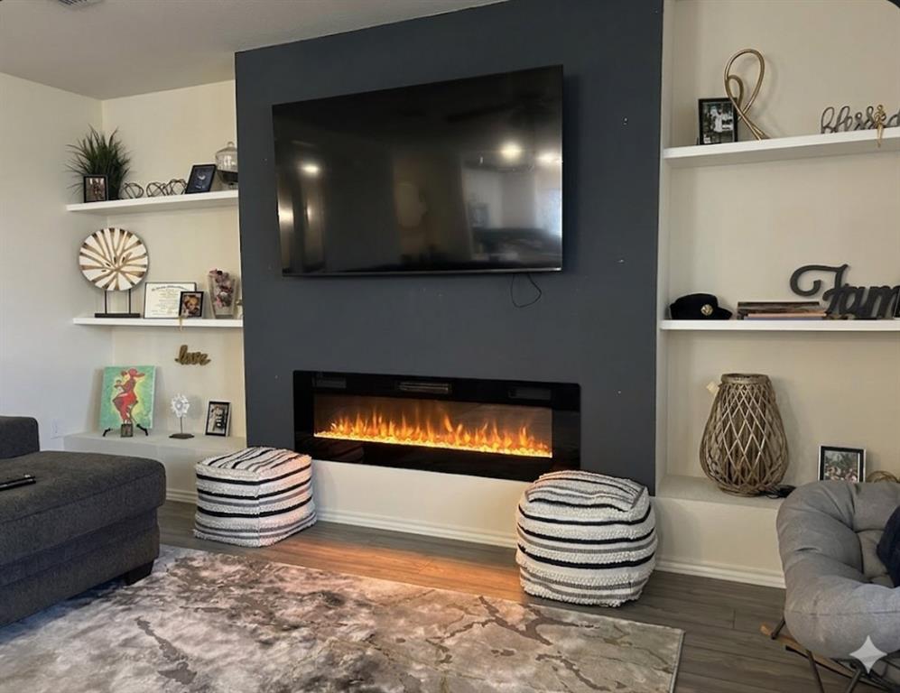 10109 Wyseby Road Crowley, TX 76036 - Photo 5 of 25 a living room with furniture and a wooden floor
