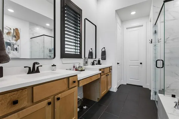 a bathroom with a bathtub and a shower