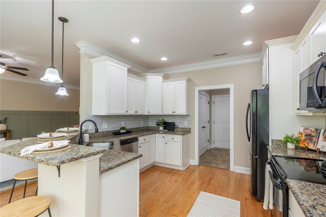234 Streams Way Anderson, SC 29625 - Photo 33 of 44 This thoughtfully designed kitchen boasts ample counter space and convenient access to additional areas.