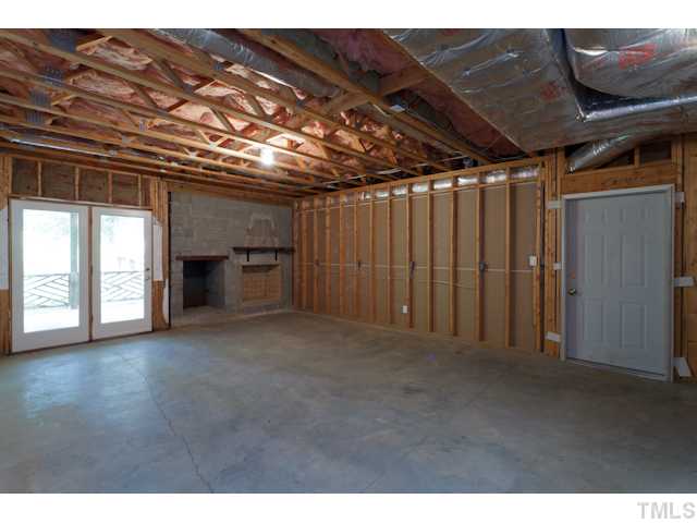 7716 Senter Farm Road Apex, NC 27539 - Photo 14 of 25 Another view of the basement. This space could easily be finished to create a comfortable apartment - complete with its own outdoor access and 1-car garage.
