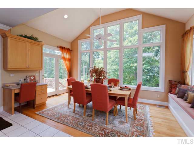 7716 Senter Farm Road Apex, NC 27539 - Photo 17 of 25 Another view of the breakfast nook, featuring the built-in desk, perfect for organizing your bills or your recipes.