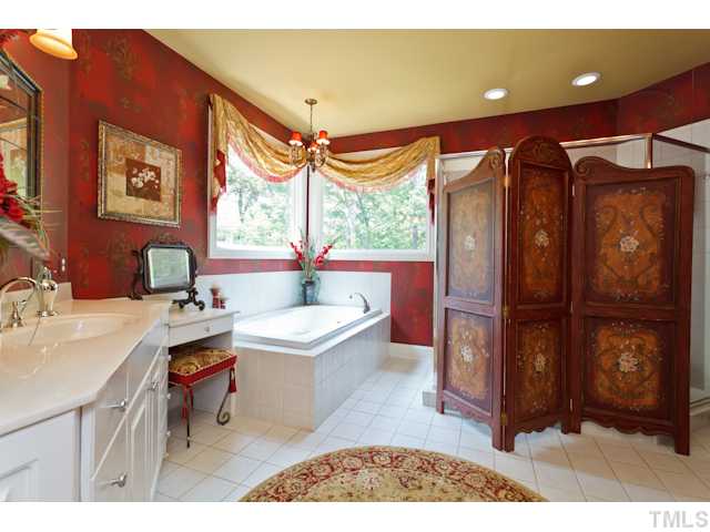 7716 Senter Farm Road Apex, NC 27539 - Photo 6 of 25 The grand master bathroom features an over sized shower, a garden tub, and double vanities. You'll enjoy the convenience of two large walk-in closets in this master suite.