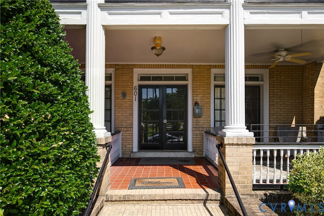 601 Roseneath Road, Unit U1 Richmond, VA 23221 - Photo 4 of 36 Brick exterior featuring a covered front porch wit