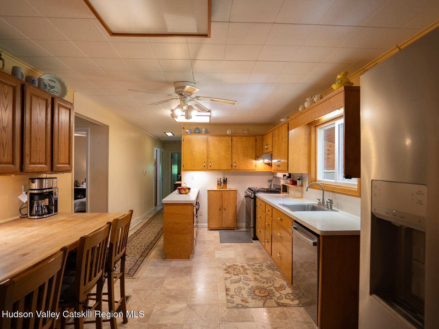59 New Forge Rd I Ancram, NY 12502 - Photo 20 of 32 a large kitchen with a table and chairs