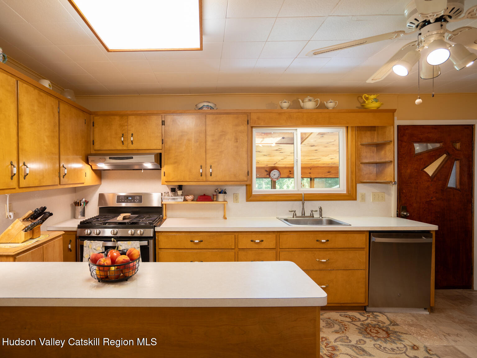 59 New Forge Rd I Ancram, NY 12502 - Photo 21 of 32 a kitchen with a sink a stove and a window
