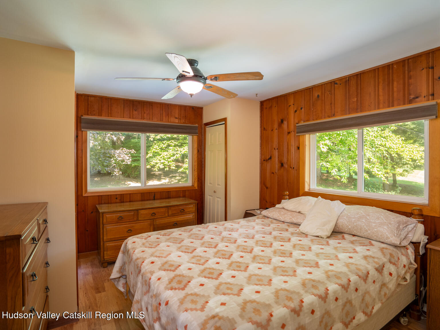 59 New Forge Rd I Ancram, NY 12502 - Photo 28 of 32 a bedroom with a large window and a bed