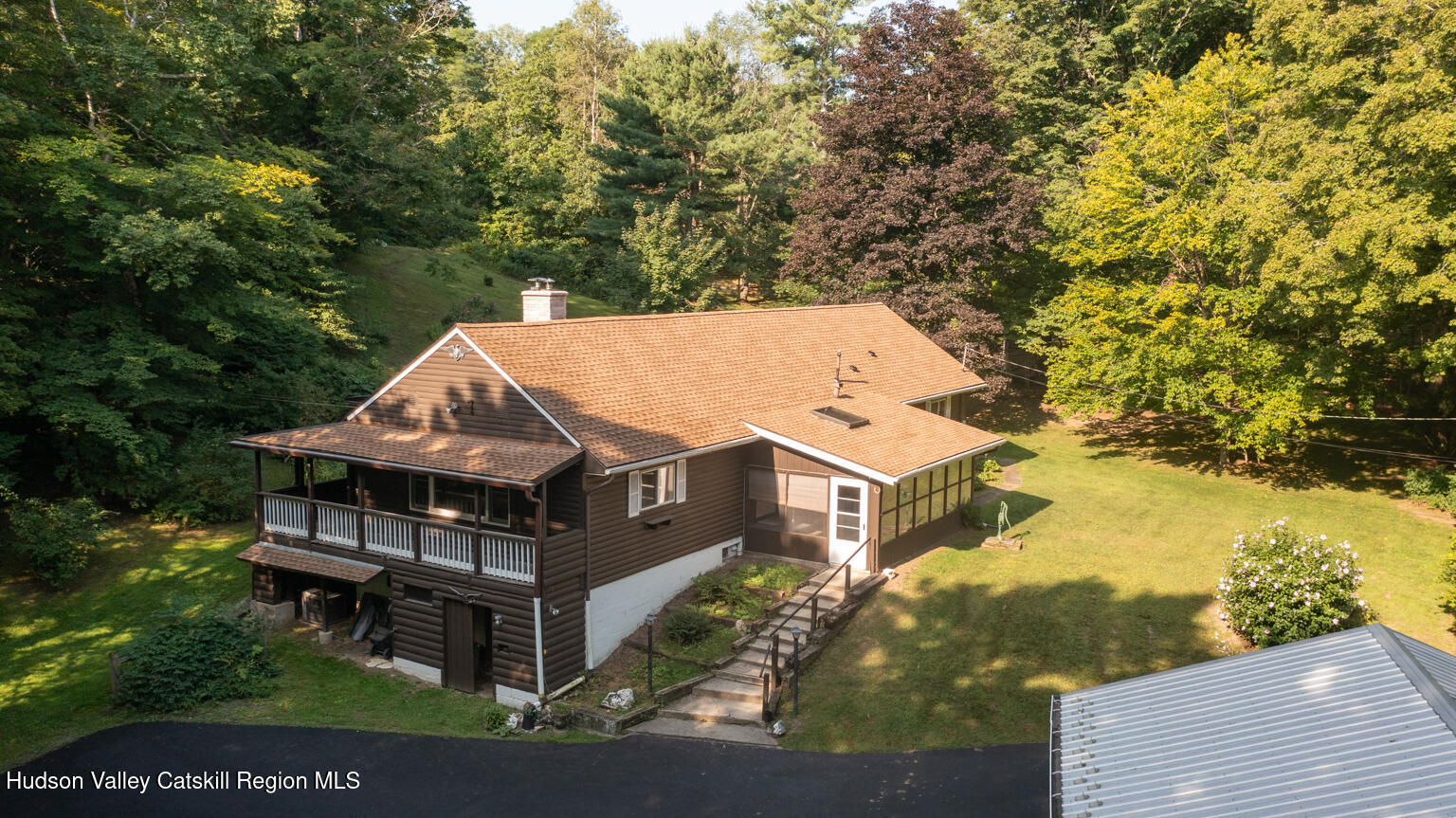 59 New Forge Rd I Ancram, NY 12502 - Photo 3 of 32 an aerial view of a house with swimming pool and large trees