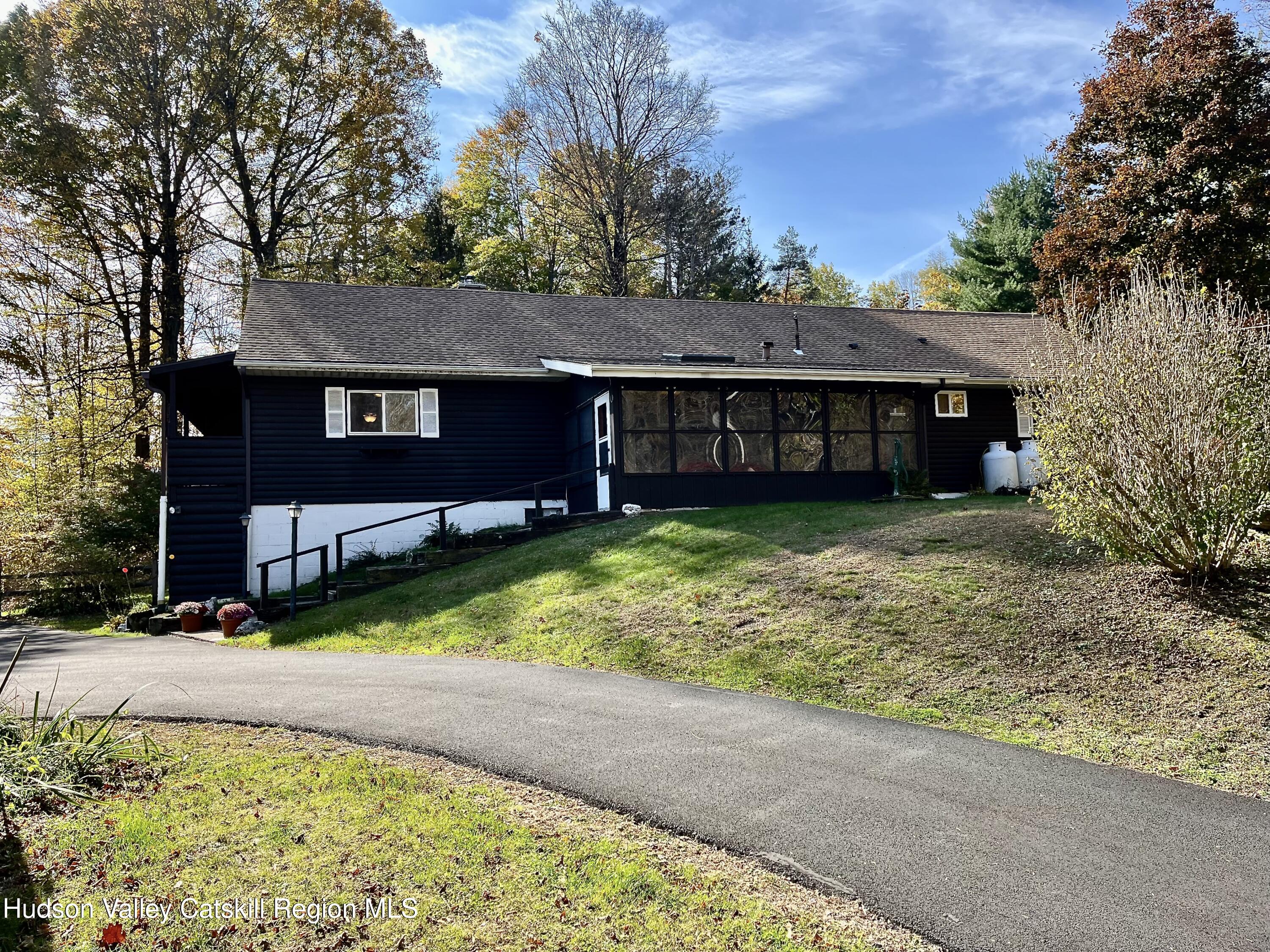 59 New Forge Rd I Ancram, NY 12502 - Photo 5 of 32 front view of a house with a yard