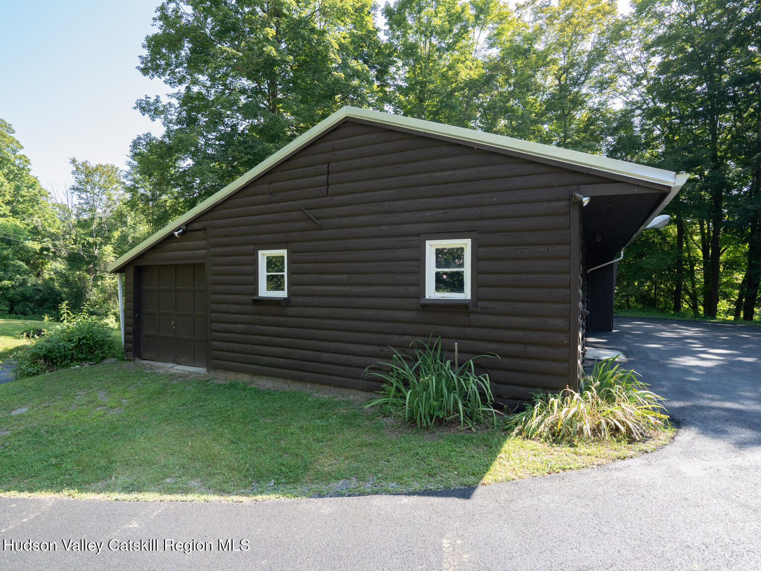 59 New Forge Rd I Ancram, NY 12502 - Photo 7 of 32 a backyard of a house with plants and trees