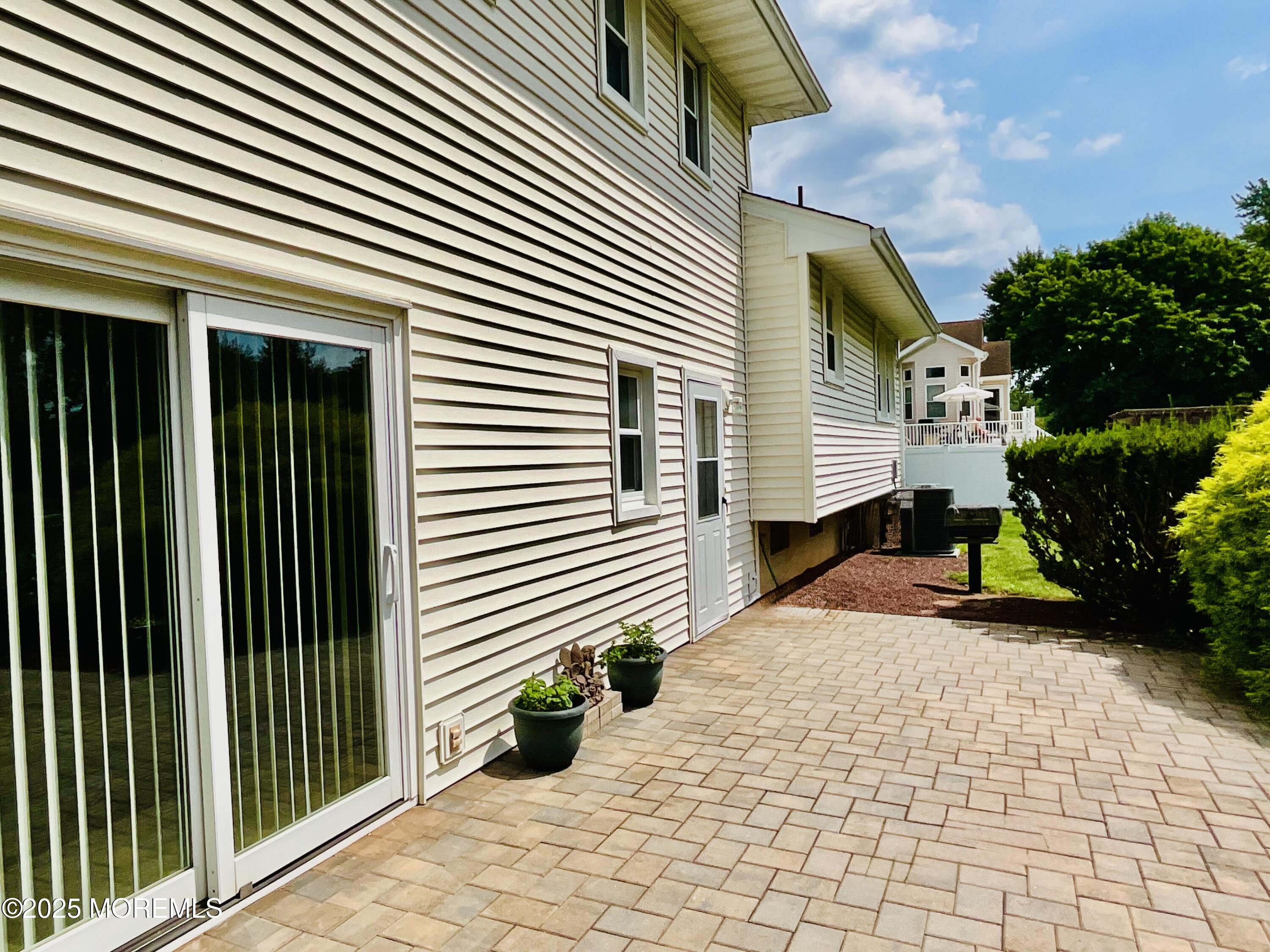 24 Homestead Road Freehold, NJ 07728 - Photo 8 of 39 a view of a house with backyard and a tree