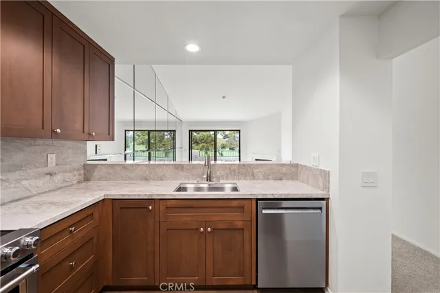 a kitchen with a sink cabinets and window