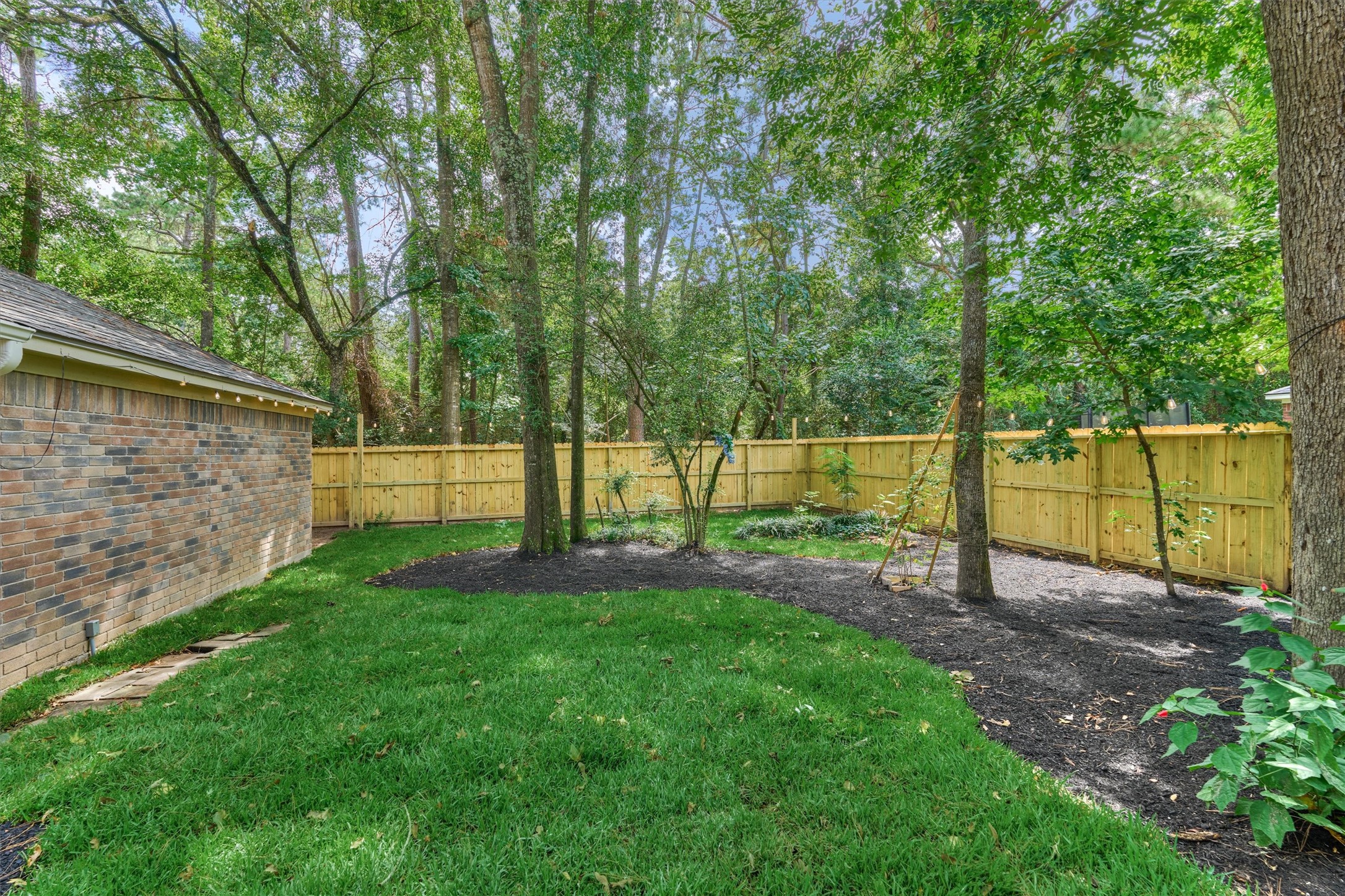71 Breezy Point Place Spring, TX 77381 - Photo 34 of 40 New backyard fence. Fully fenced. No rear neighbors. Plenty of green space for pets or play.