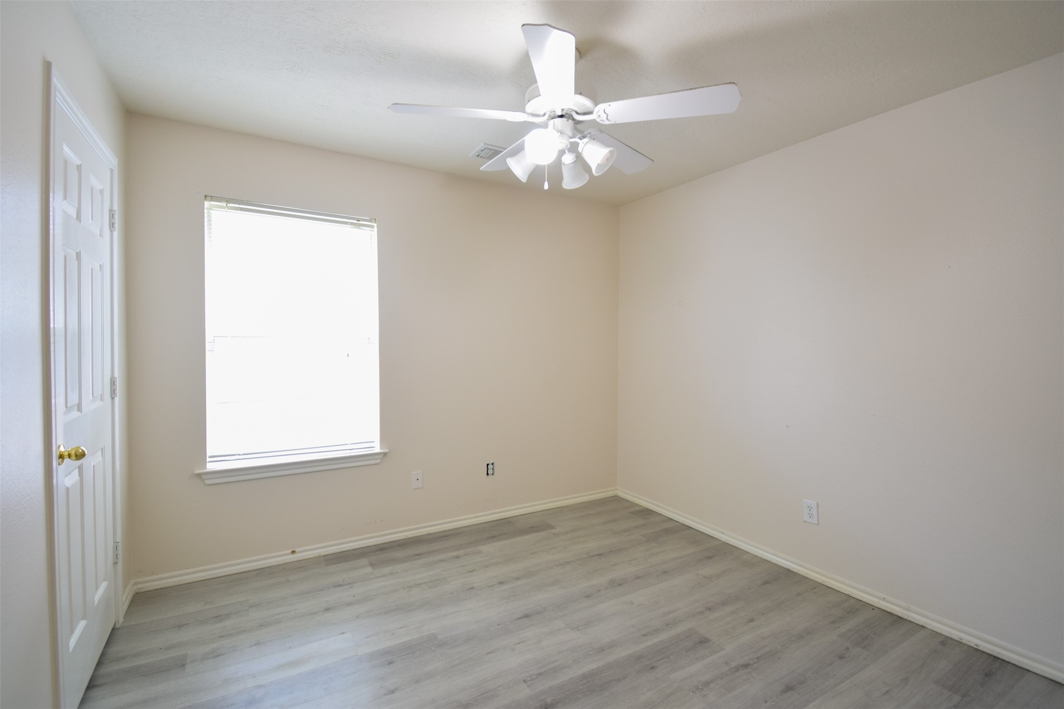 21315 Pepperberry Trail Spring, TX 77388 - Photo 13 of 21 an empty room with wooden floor and windows