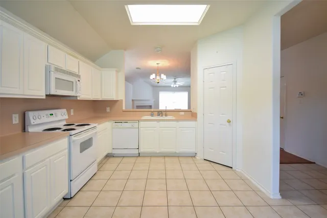 a kitchen with a cabinets and appliances