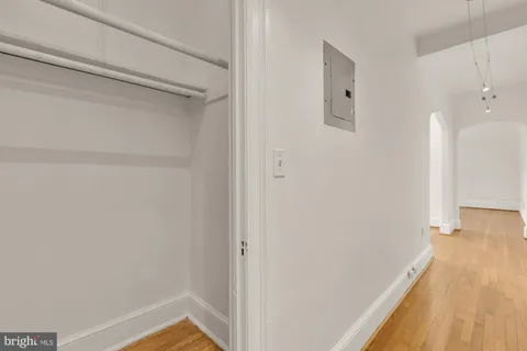 a view of a room with wooden floor