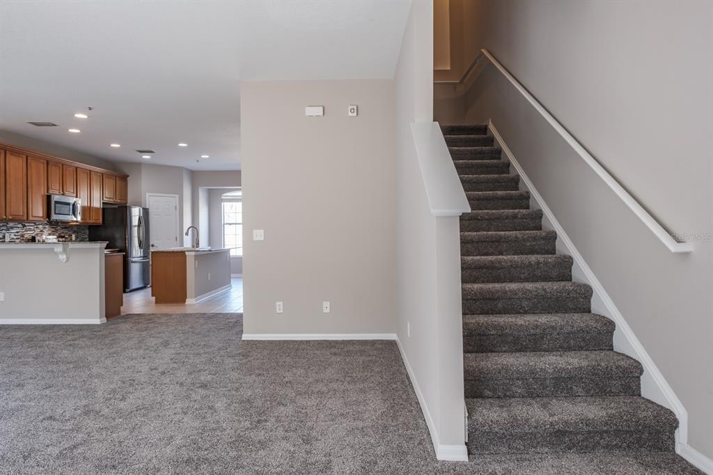 10220 Bayou Grande Seminole, FL 33772 - Photo 16 of 50 a view of a kitchen with wooden floor and stairs