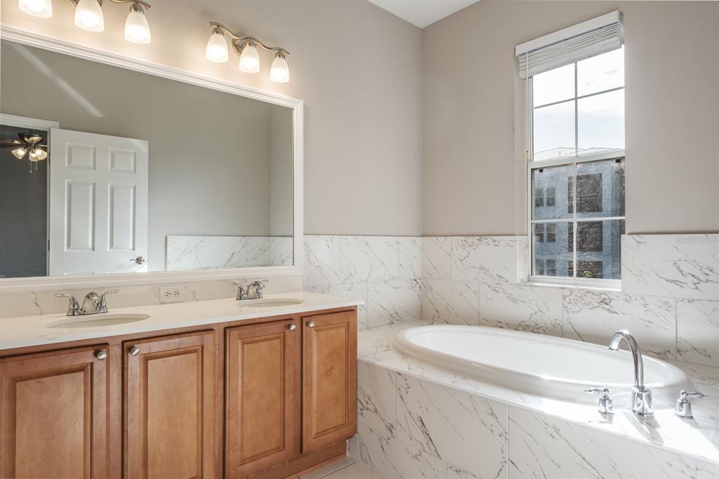 10220 Bayou Grande Seminole, FL 33772 - Photo 31 of 50 a bathroom with a sink and a bathtub