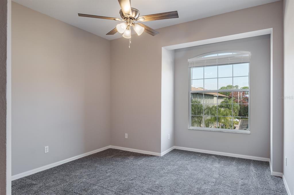 10220 Bayou Grande Seminole, FL 33772 - Photo 34 of 50 an empty room with windows and ceiling fan