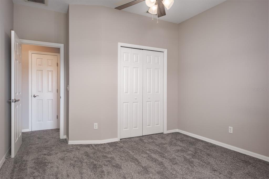 10220 Bayou Grande Seminole, FL 33772 - Photo 36 of 50 an empty room with a chandelier fan