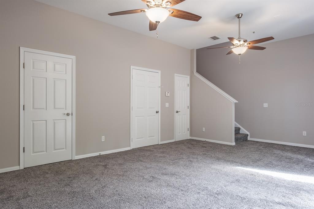 10220 Bayou Grande Seminole, FL 33772 - Photo 10 of 50 a view of an empty room with chandelier fan