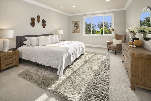 a spacious bathroom with a double vanity sink mirror and shower